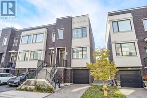 Vaughan (Vellore Village) townhouse for rent - A row of townhouses with a car parked in front of the first one.
