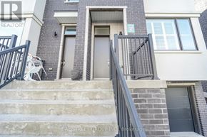 Vaughan (Vellore Village) townhouse for rent - A house with a grey front door and a black gate.