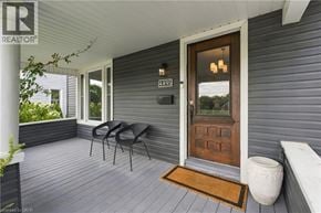 Niagara Falls apartment for rent - A wooden door with a glass window is on the right side of the image.