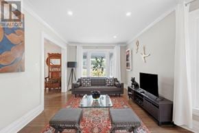 Niagara Falls (Downtown) apartment for rent - A living room with a grey couch and a glass coffee table.