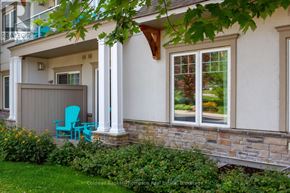 Huntsville (Chaffey) condo for rent - A blue chair sits on a porch with a white wall and a window.
