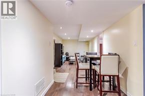 Hamilton apartment for rent - A dining room with a table and chairs is shown.