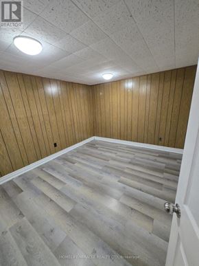 Toronto (L'amoreaux) apartment for rent - A room with wooden walls and a wooden floor.