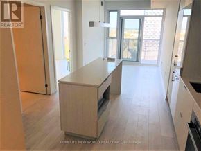 Toronto (Waterfront Communities) condo for rent - A kitchen with a countertop and cabinets is shown in a real estate listing.