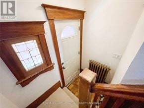 Toronto (Danforth Village-East York) apartment for rent - A white door is in a room with a window above it.