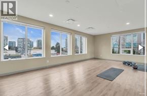 Richmond townhouse for rent - A spacious room with a yoga mat on the floor.
