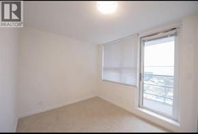Richmond townhouse for rent - A room with a window and a view of a parking lot.