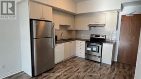 Markham (Village Green-South Unionville) condo for rent - A kitchen with a refrigerator, oven, and sink.