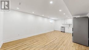 Markham (Aileen-Willowbrook) apartment for rent - A large, empty room with wooden flooring and white walls.