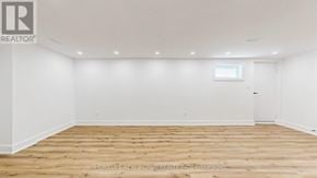 Markham (Aileen-Willowbrook) apartment for rent - A large empty room with wooden flooring and white walls.