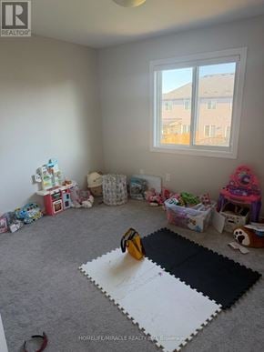 Thorold (Rolling Meadows) apartment for rent - A room with a large window and toys scattered on the floor.