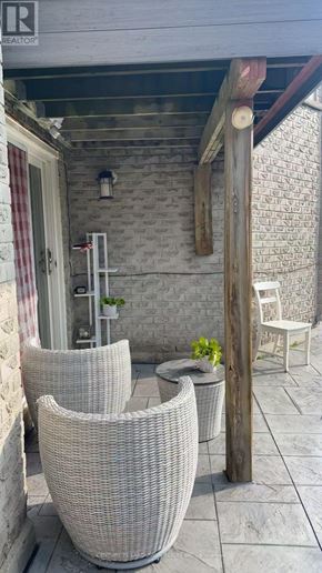 Markham (Markville) apartment for rent - A patio with a chair and a table.