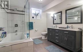 Markham (Markville) apartment for rent - A bathroom with a glass shower stall and a white toilet.