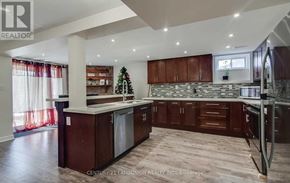 Markham (Markville) apartment for rent - A modern kitchen with dark wood cabinets and a stone backsplash.