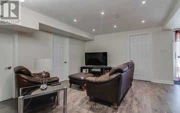 Markham (Markville) apartment for rent - A living room with brown leather furniture and a flat screen TV.