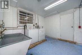 Kitchener multi-family for rent - A brokerage office with a sink and a window.