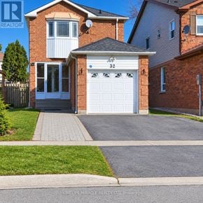 Brampton (Fletcher's West) apartment for rent - A house with the number 32 on the garage door.