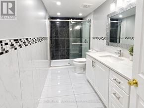 Brampton (Fletcher's West) apartment for rent - A white bathroom with a black and white checkered tile border.