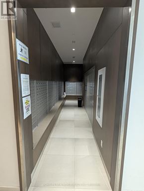Toronto (Don Valley Village) condo for rent - A hallway with a sign that says "No Parking" on the wall.