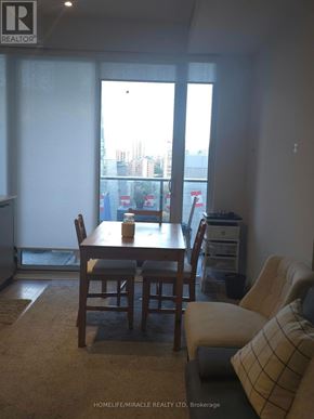 Toronto (Bay Street Corridor) condo for rent - A dining room with a table and chairs is shown.