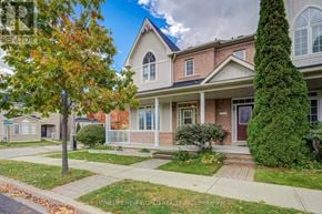 Markham (Cornell) apartment for rent - A house with a red door and a tree with orange leaves in front.