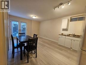 Burnaby apartment for rent - A dining room with a table and chairs is shown.
