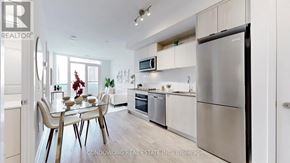 Toronto (Church-Yonge Corridor) condo for rent - A modern kitchen with a dining table and chairs.