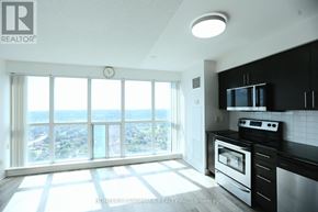Toronto (Bendale) condo for rent - A modern kitchen with a view of the city.