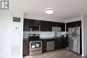 Toronto (Bendale) condo for rent - A kitchen with a stove, refrigerator, and cabinets.