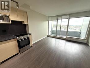 Vancouver apartment for rent - A kitchen with a stove top oven and a microwave.