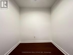 Toronto (Forest Hill South) condo for rent - A room with white walls and a wooden floor.