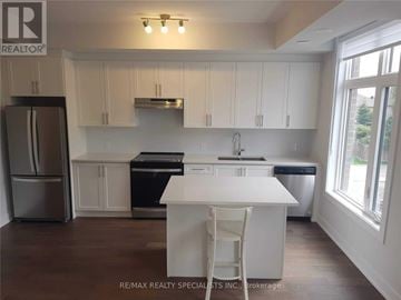 Vaughan (Sonoma Heights) townhouse for rent - A white kitchen with a refrigerator, oven, and sink.