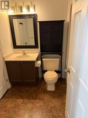 St. Catharines (Oakdale) condo for rent - A bathroom with a toilet, sink, and medicine cabinet.