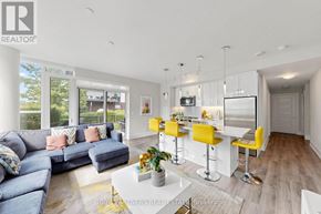 Innisfil condo for rent - A modern living room with a bar area and a kitchen in the background.