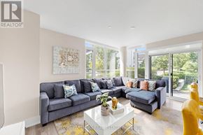 Innisfil condo for rent - A living room with a grey couch and a coffee table.