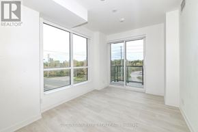 Mississauga (Lakeview) condo for rent - A room with a view of a street through the windows.