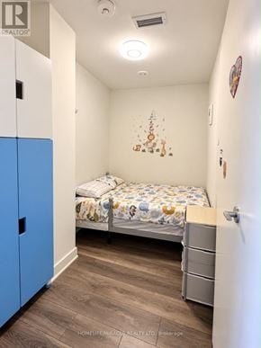 Toronto (Don Valley Village) condo for rent - A bedroom with a bed, drawers, and a cabinet.