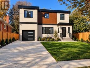 Toronto (Bendale) multi-family for rent - A modern two-story house with a garage is for sale.