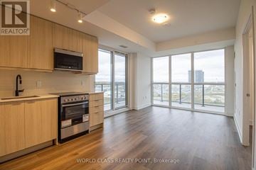 Milton (Om Old Milton) condo for rent - A modern kitchen with wooden cabinets and a stainless steel oven.