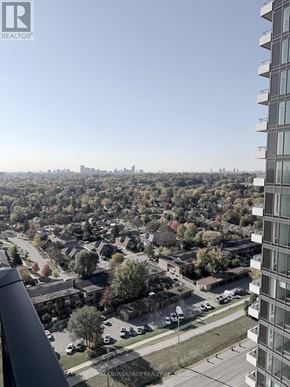 Toronto (Humber Heights) condo for rent - A view from a high-rise building looking down at a residential neighborhood.