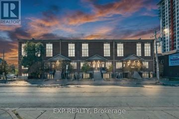 Kitchener townhouse for rent - A building with the sign EXP REALTY, Brokerage in front of it.