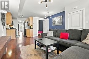Kitchener townhouse for rent - A living room with a grey couch and a coffee table.