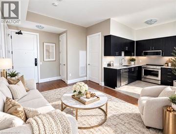 Guelph condo for rent - A well-lit living room with a coffee table in the center.