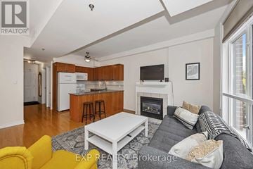 Ottawa condo for rent - A living room with a grey couch and a white coffee table.