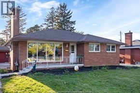 Windsor apartment for rent - A house with a red brick exterior and a white door.