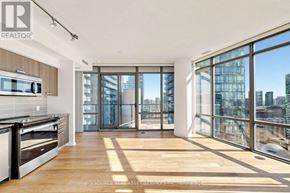 Toronto (Bay Street Corridor) condo for rent - A modern kitchen with a view of the city.