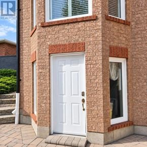 Innisfil (Alcona) apartment for rent - A white door is on the front of a brick house.