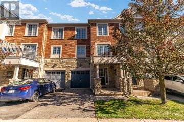 Markham (Berczy) townhouse for rent - A Royal LePage Signature Realty brochure is displayed on a building.