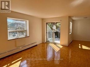 Mississauga (Cooksville) house for rent - A room with a window and a door leading outside.