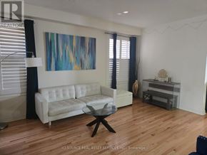 Milton (Ha Harrison) apartment for rent - A living room with a white couch and a glass coffee table.
